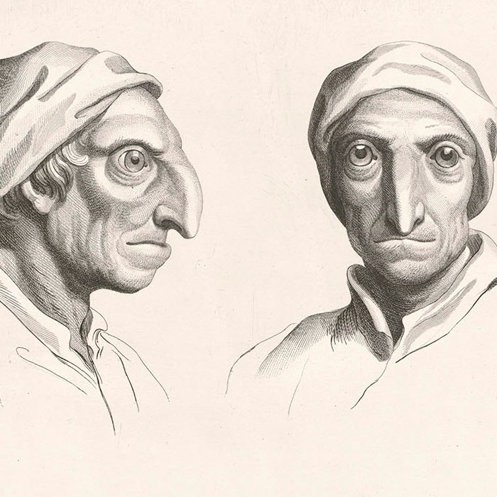 Deux têtes de perroquets et deux têtes d’hommes en relation avec le perroquet - Une estampe d’après Charles Le Brun