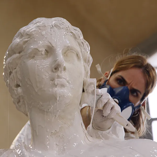 Close-up of the sculpture’s head from which the liquid elastomer is running